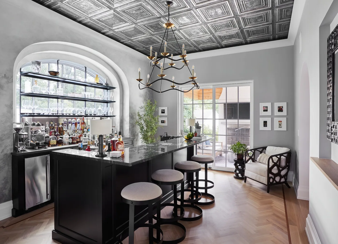 Casacquasanta home pub with a pressed-tin ceiling, dark bar and chandelier in Westfield, NJ
