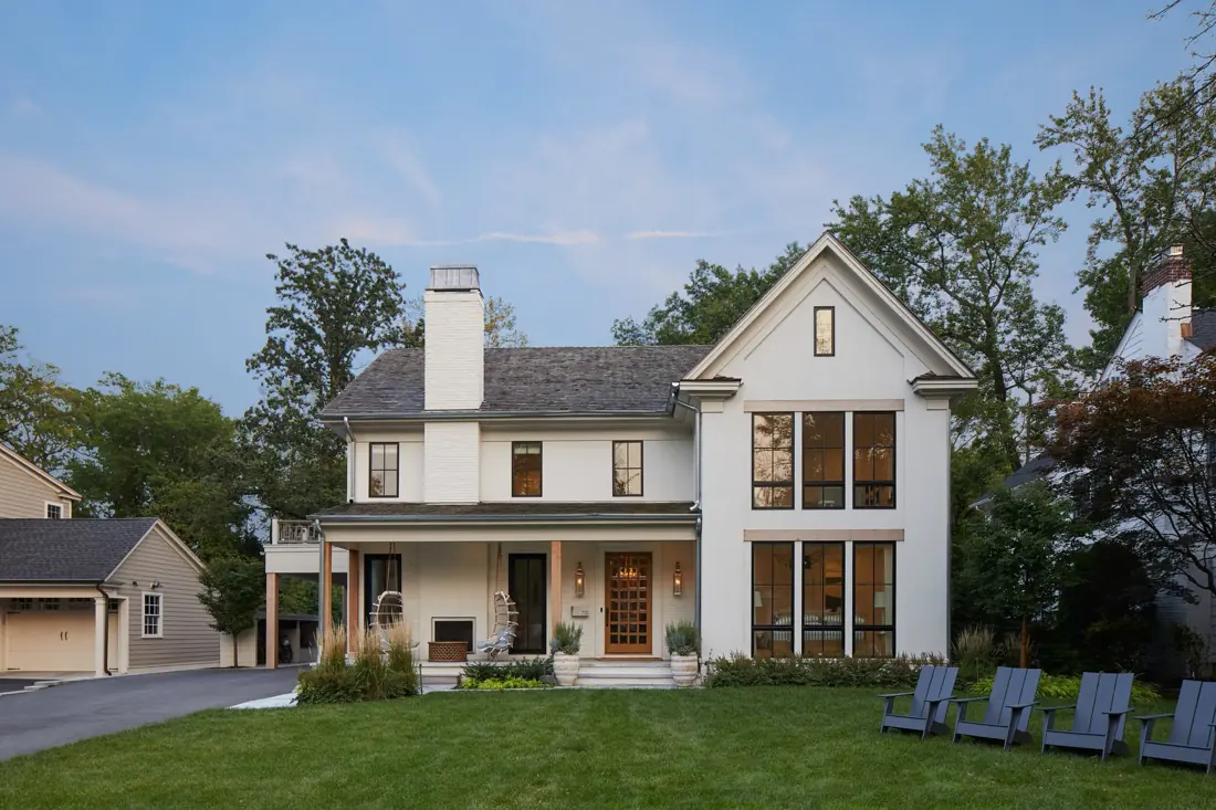 Two-story Westfield home with a covered front porch, lawn and mature trees